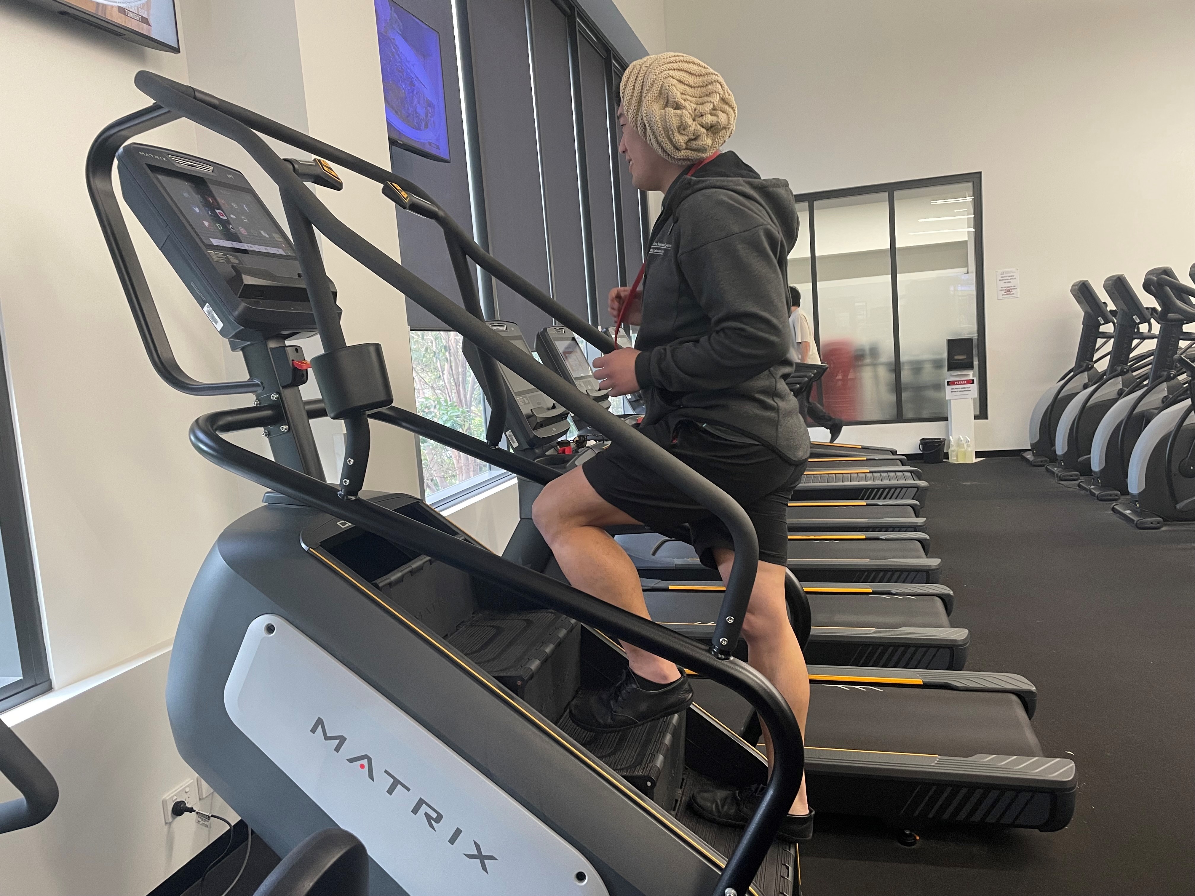 Man on stair climb machine